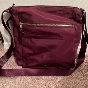 Tumi crossbody bag. Burgandy